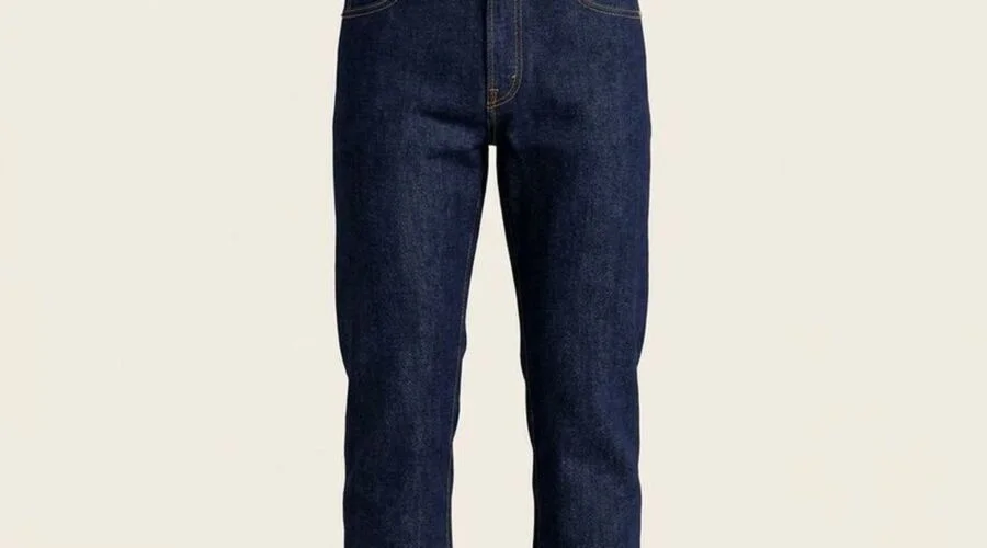 Front of dark indigo straight jeans laid out flat, unfaded and crisp
