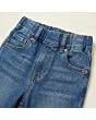 Close-up of the waistband, button and fly on kids' pull-on jeans