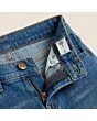 Close-up of the waistband, button and fly on kids' regular jeans
