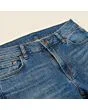 Close-up of the waistband, button and fly on men's bootcut jeans