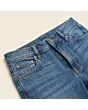 Close-up of the waistband, button and fly on women's bootcut jeans