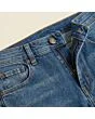 Close-up of the waistband, button and fly on men's slim jeans