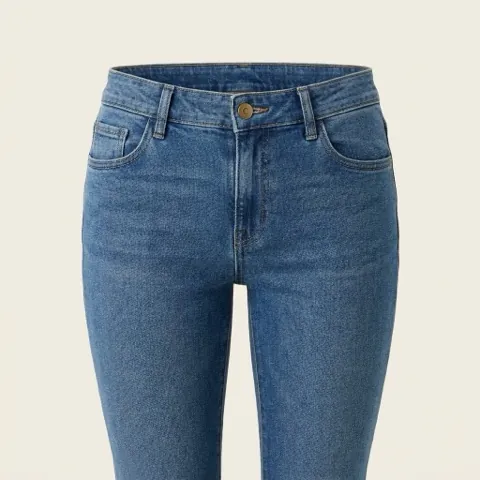 Close-up of a low-rise waistband sitting below the navel