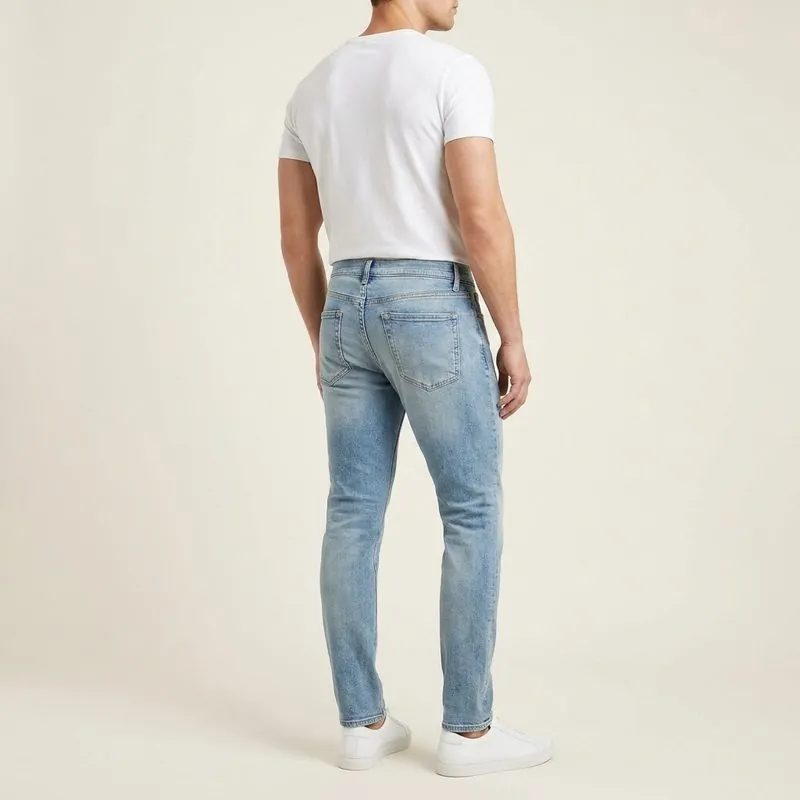 Slim jeans worn by a man with an inverted triangle body shape, back view