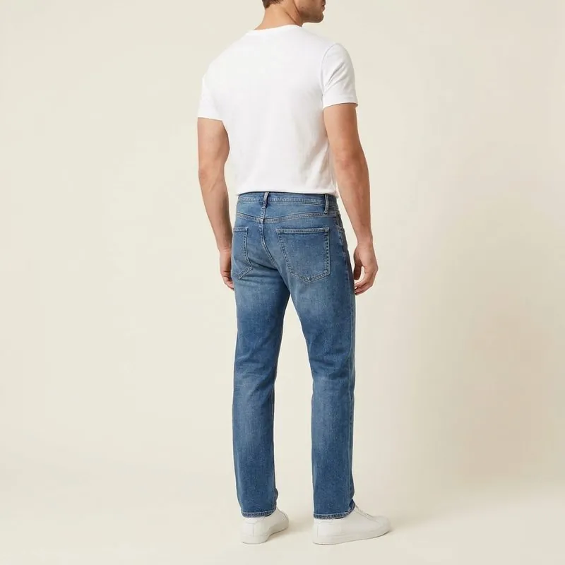 Straight jeans worn by a man with an inverted triangle body shape, back view