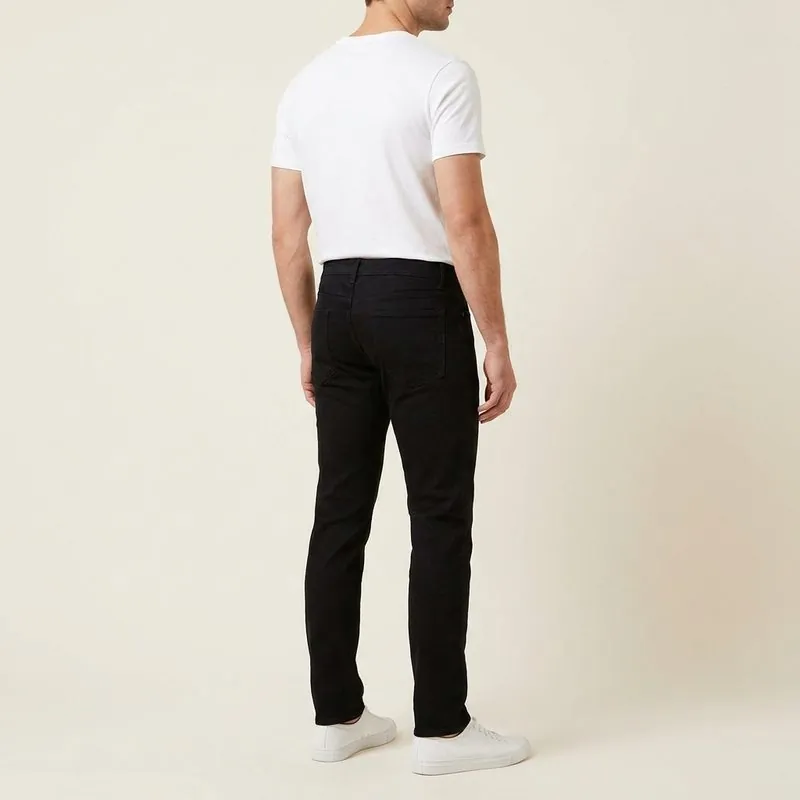 Slim jeans worn by a man with a rectangle body shape, back view