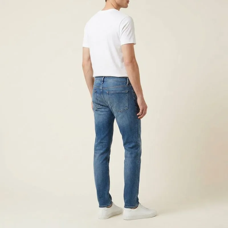 Tall Men's Jeans: Athletic Taper jeans worn on a model