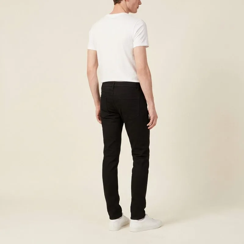 Slim jeans worn by a man with an ectomorph body type, back view