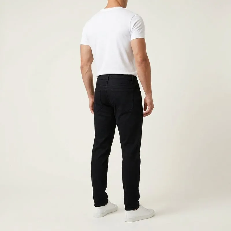 Athletic Taper jeans worn by a man with a mesomorph body type, back view