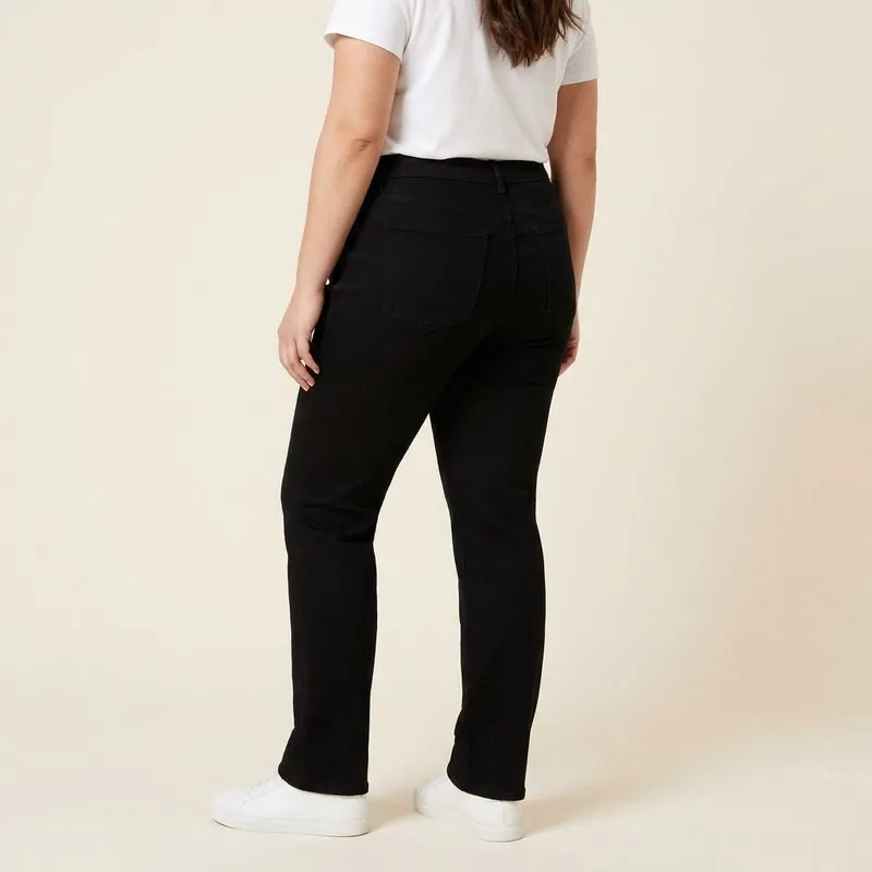Straight jeans worn by a woman with an apple-shaped body, back view