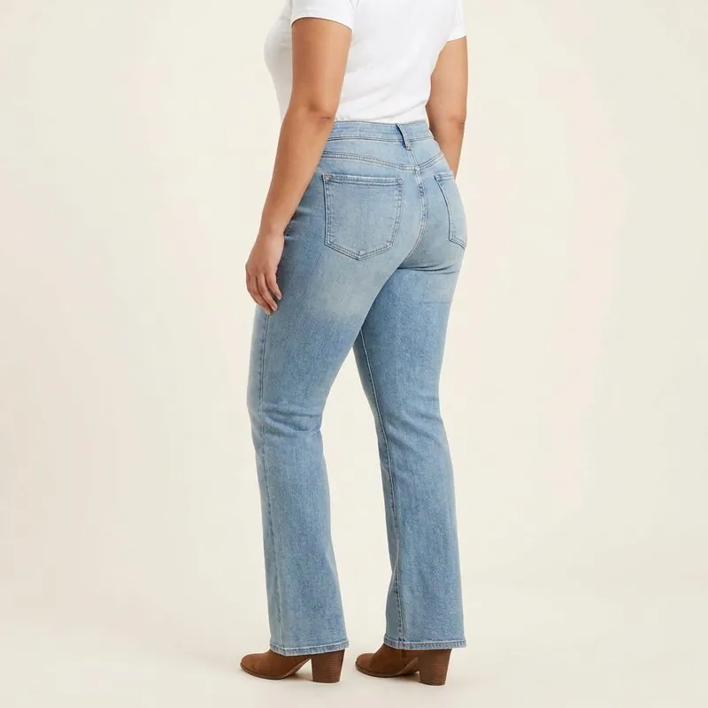 Bootcut jeans worn by a woman with a barrel body shape, back view