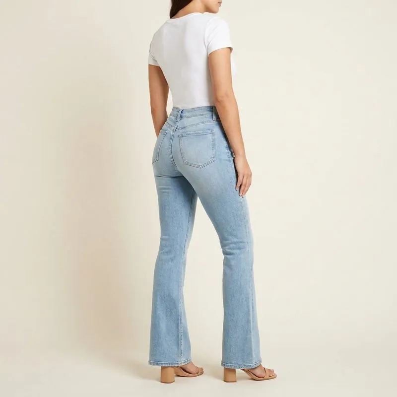 Flare jeans worn by a woman with a bottom hourglass shape, back view