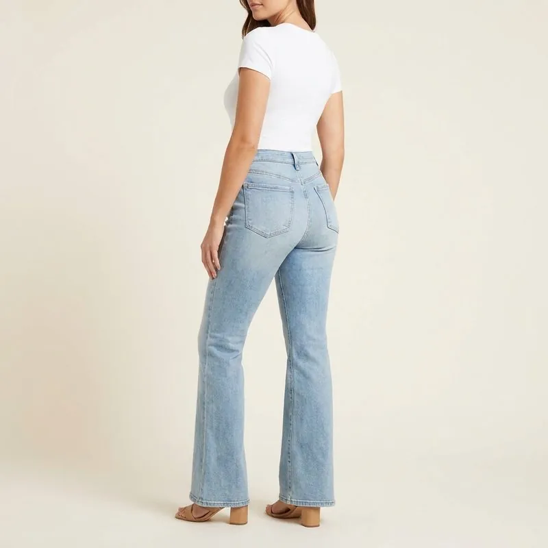 Flare jeans worn by a woman with an inverted triangle body shape, back view