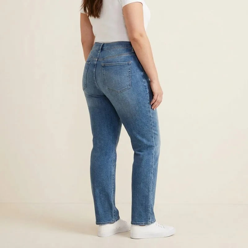 Straight jeans worn by a woman with a pear-shaped body, back view