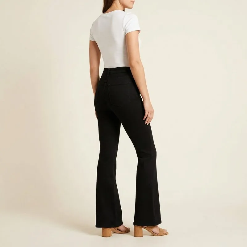 Flare jeans worn by a woman with a rectangle body shape, back view
