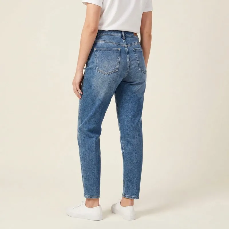 Mom jeans worn by a woman with a rectangle body shape, back view