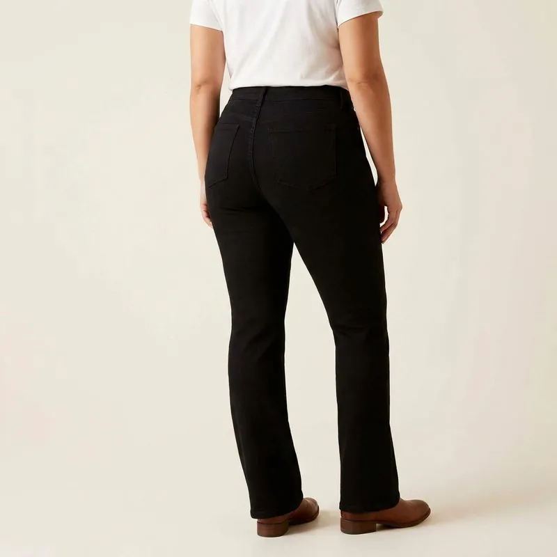 Bootcut jeans worn by a woman with a spoon body shape, back view