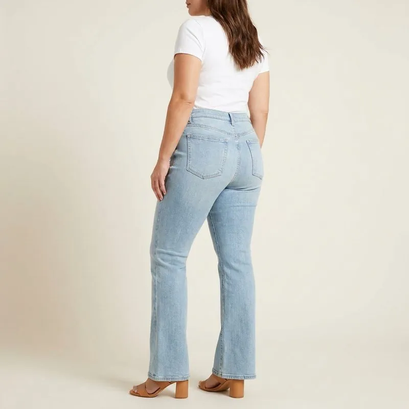 Flare jeans worn by a woman with a spoon body shape, back view