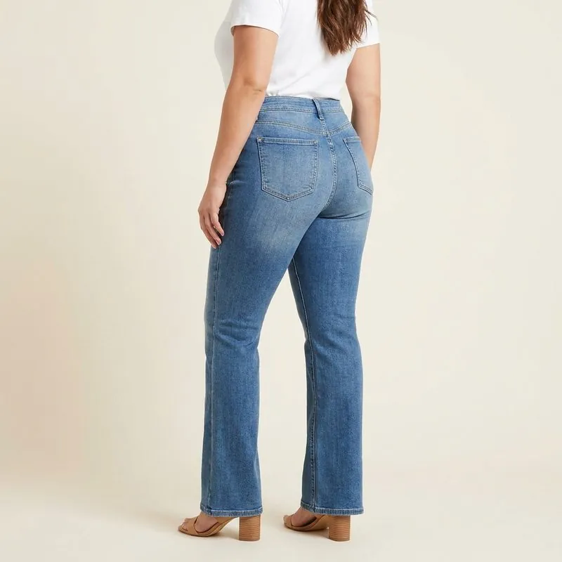 Flare jeans worn by a woman with a top hourglass shape, back view