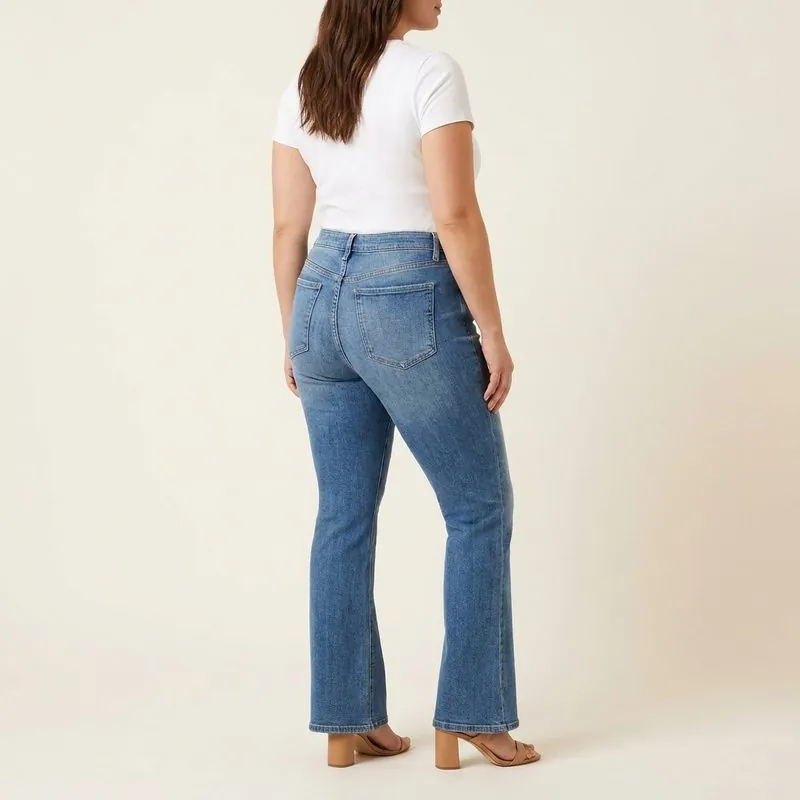 Flare jeans worn by a woman with a trapezoid body shape, back view