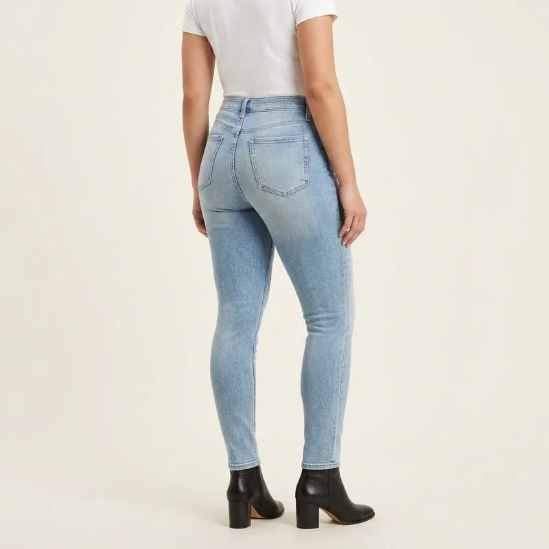 Skinny jeans worn by a woman with a trapezoid body shape, back view