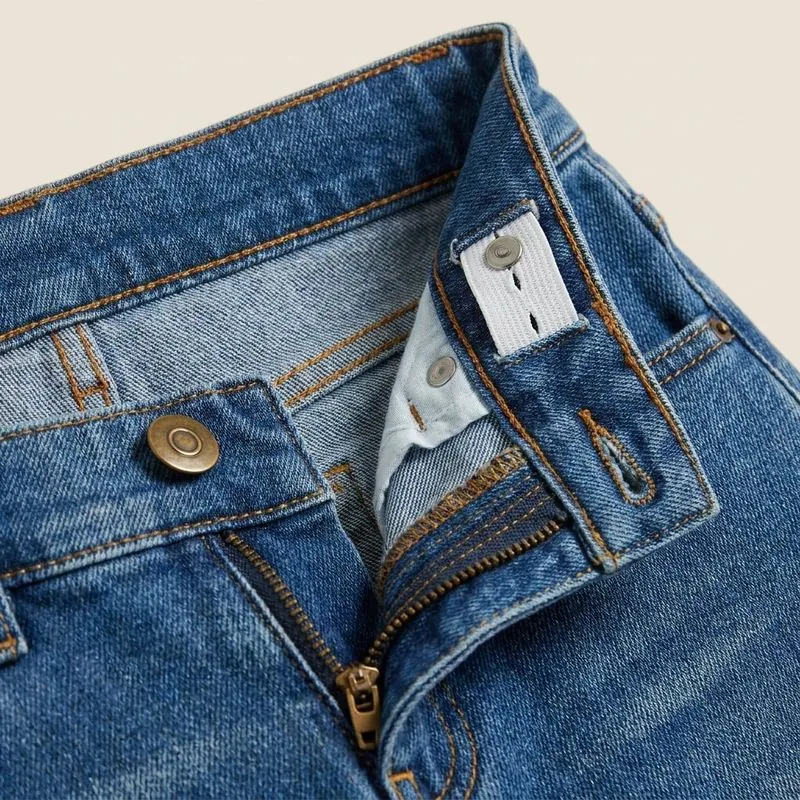 Close-up of the waistband, button and fly on children's jeans