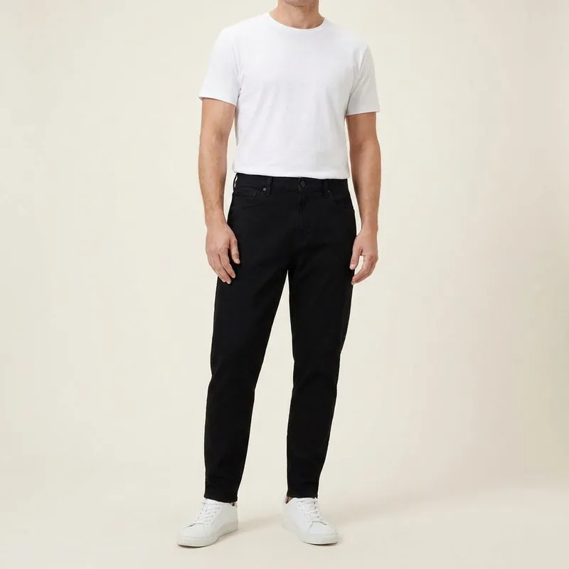 The Athletic Taper – Men's Custom Jeans in black, worn on a model