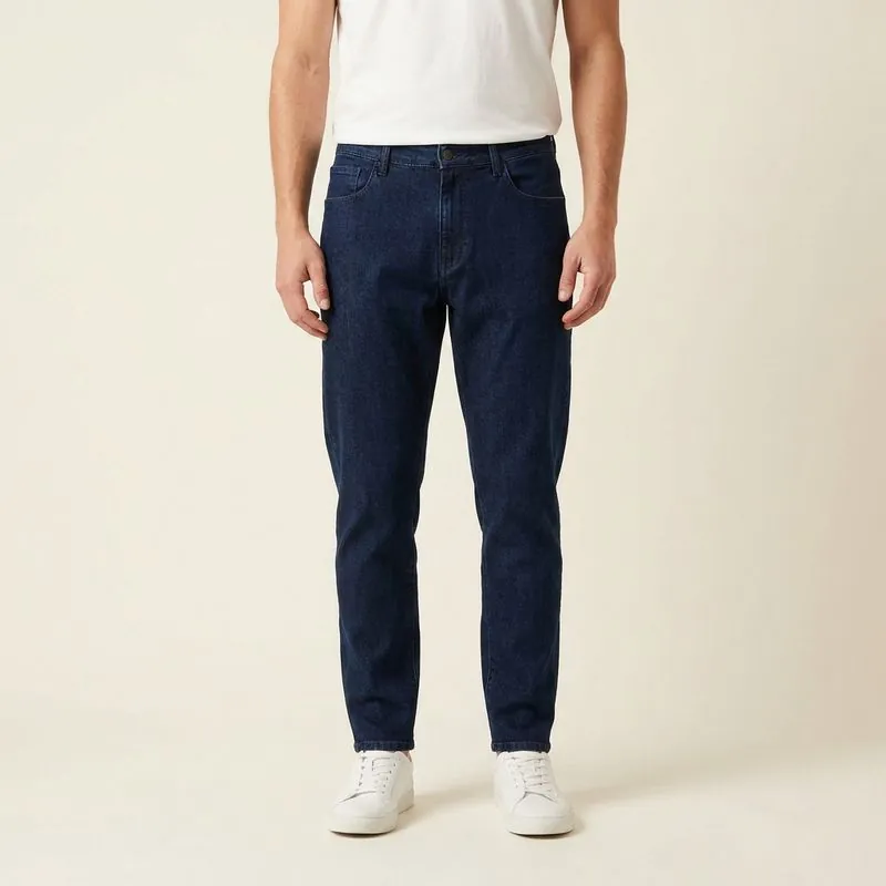 Athletic Taper jeans in dark wash, worn on a model