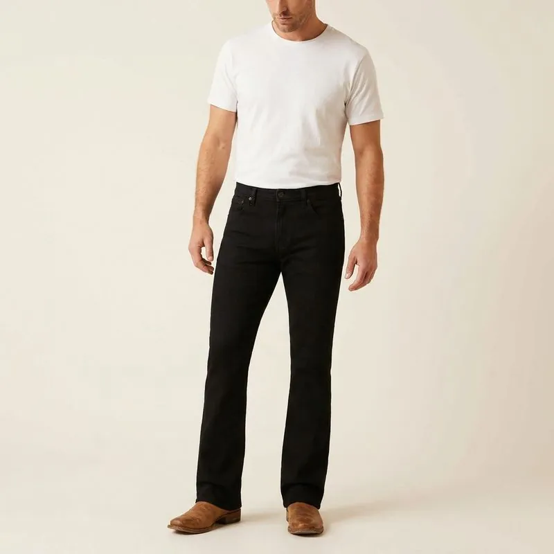 Bootcut jeans in black wash, worn on a model