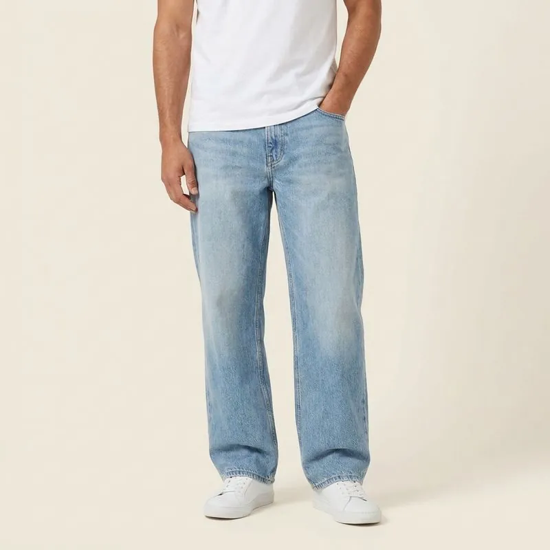 Model in light-wash relaxed jeans with a straight, roomy leg