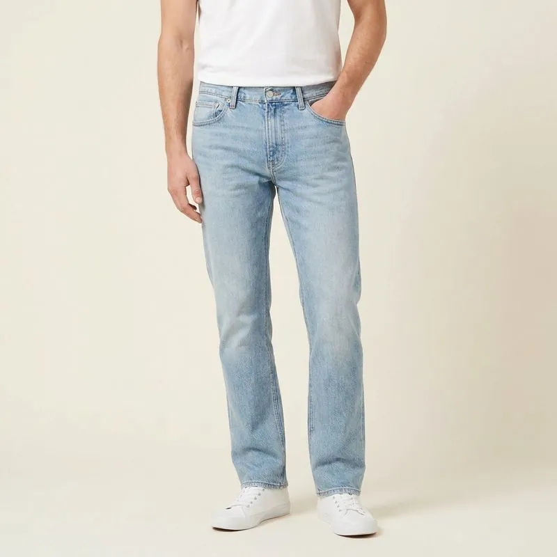 Straight jeans in light wash, worn on a model