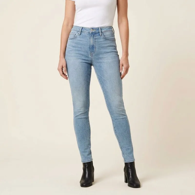 Model in light-wash skinny jeans